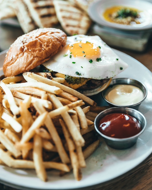 Burger with egg and fries